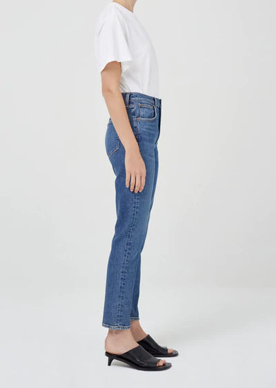 Worn denim blue. Mid rise fit is cut with a slim-straight leg and ankle grazing inseam. Low stretch denim.