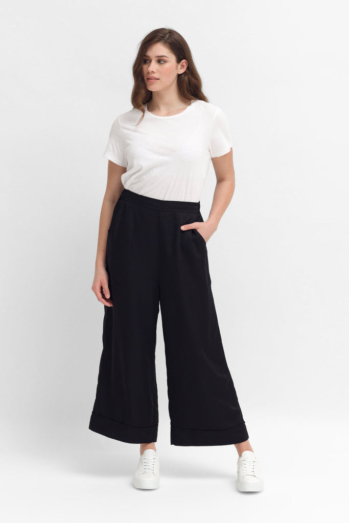 A wide leg pant, made with 100% Viscose. A shiny material, large cuff at bottom.